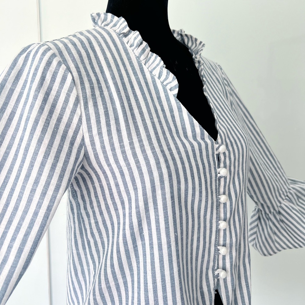 Jeykey White and Blue Striped Blouse with Pearl Buttons and tied at the bottom.
